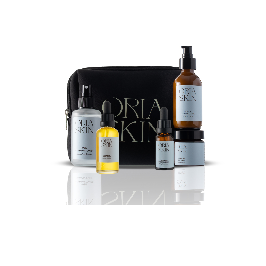 Oria Skin skincare product set with black pouch on a white background