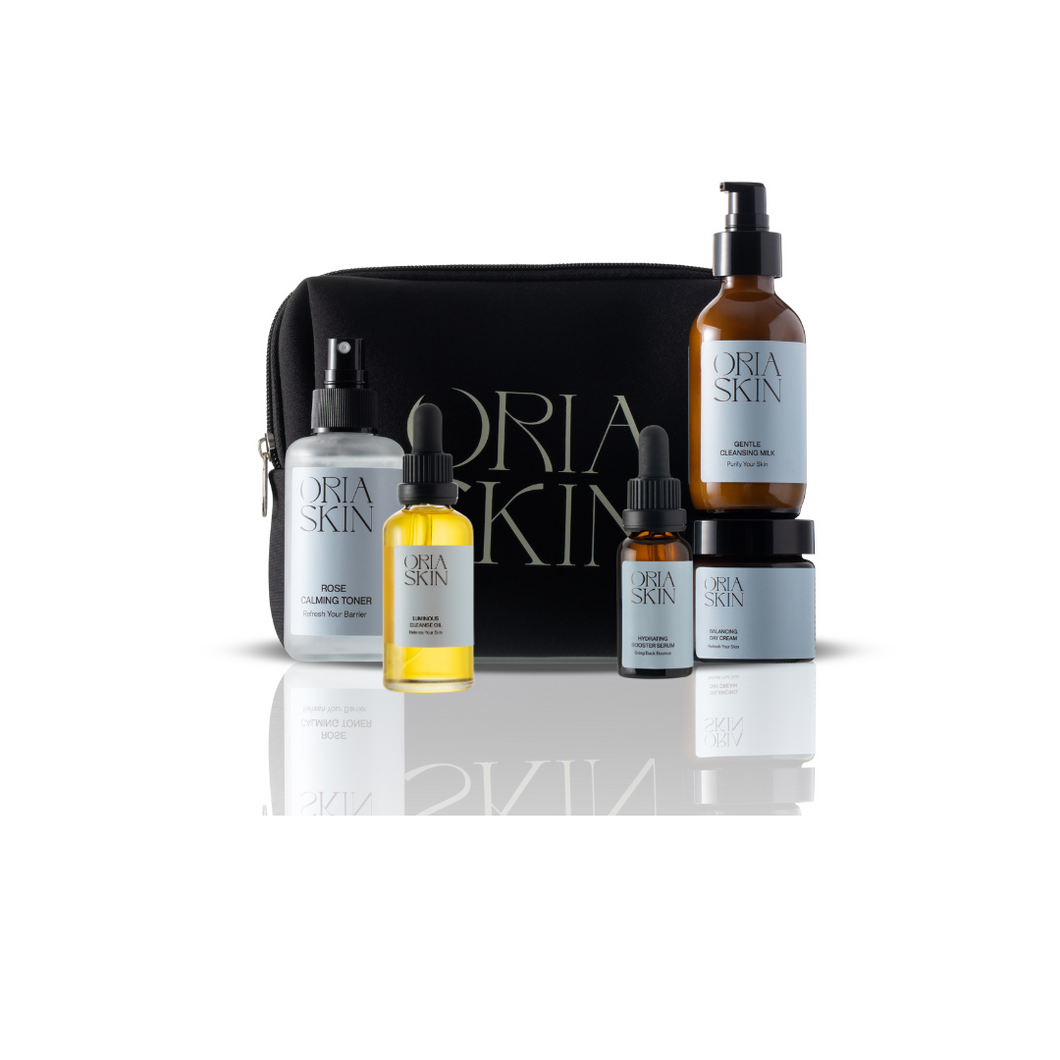Oria Skin skincare product set with black pouch on a white background